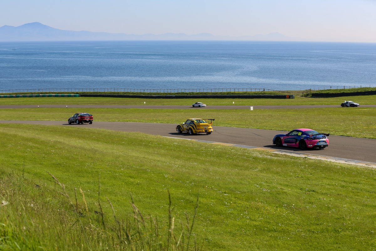 VANHAUEN RACING at Anglesey 2023 - Racing along the coast in Saturday's sunshine, with the Welsh mountains on the horizon. © Jonathan Elsey Motorsport Photography 2023