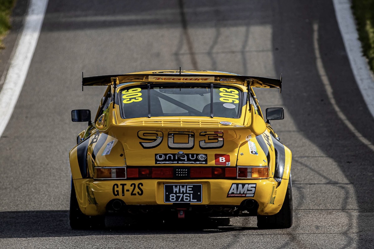 Heading to the start — adrenaline building, spoiler proud, and the rear-engine roar coming to life.